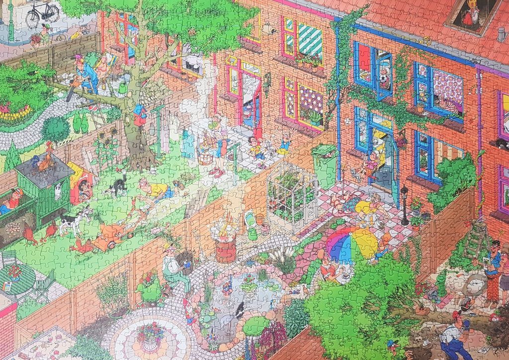 An overhead, humorous illustration of a bustling neighborhood with multiple connected back gardens and brick houses.
