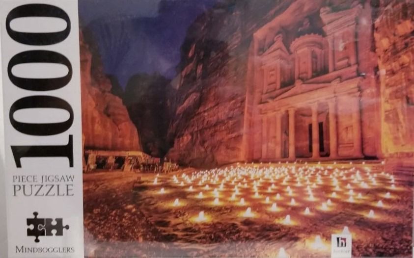 The Treasury at Petra illuminated by rows of candles at night.
