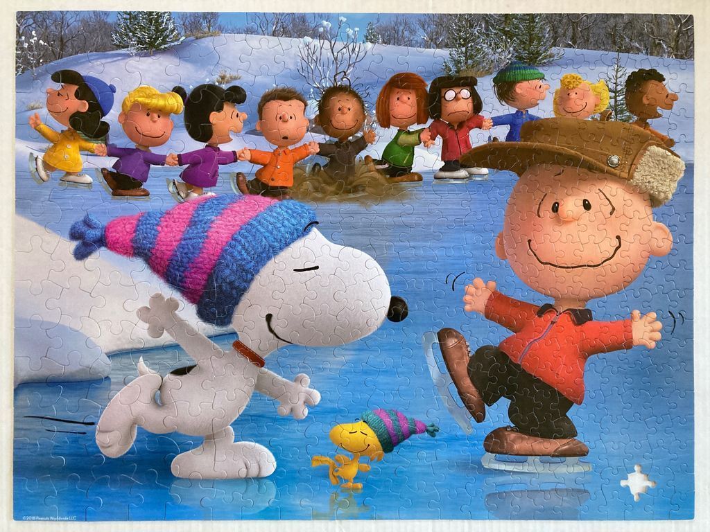 Charlie Brown, Snoopy, and their friends ice skating on a frozen pond in a winter landscape.