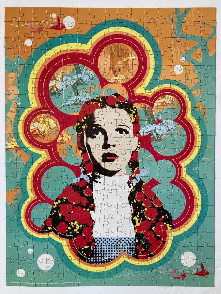 A stylized artistic portrait of Dorothy Gale surrounded by vibrant, psychedelic colorful patterns.