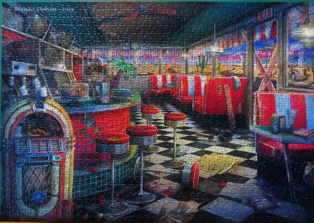 An atmospheric, abandoned 1950s-style diner interior at twilight, featuring red booths, a jukebox, and checkerboard floor.