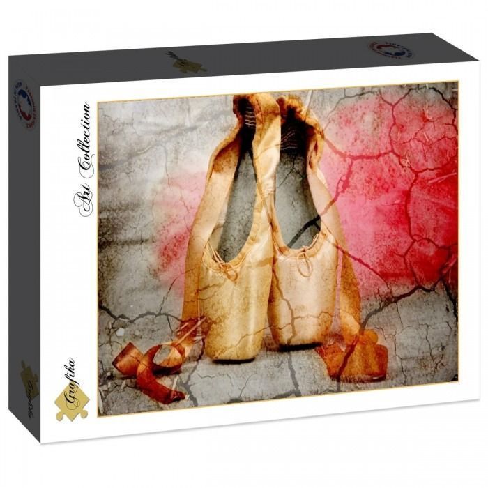 Pair of worn ballet pointe shoes placed against a cracked, textured background in shades of beige and red.