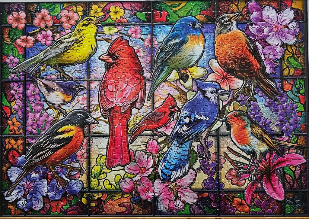 A vibrant stained glass style illustration featuring various colorful birds perched among flowers.
