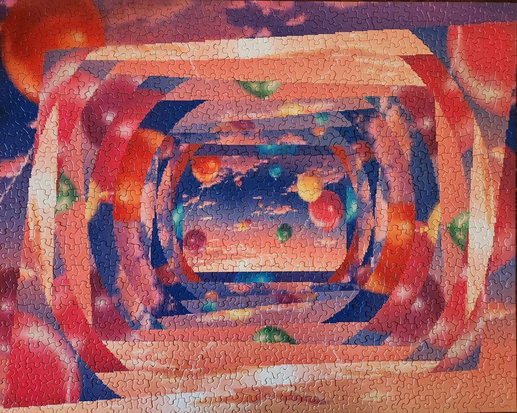 An abstract surrealist tunnel effect featuring multiple layers of pink and orange frames surrounding a sunset sky.