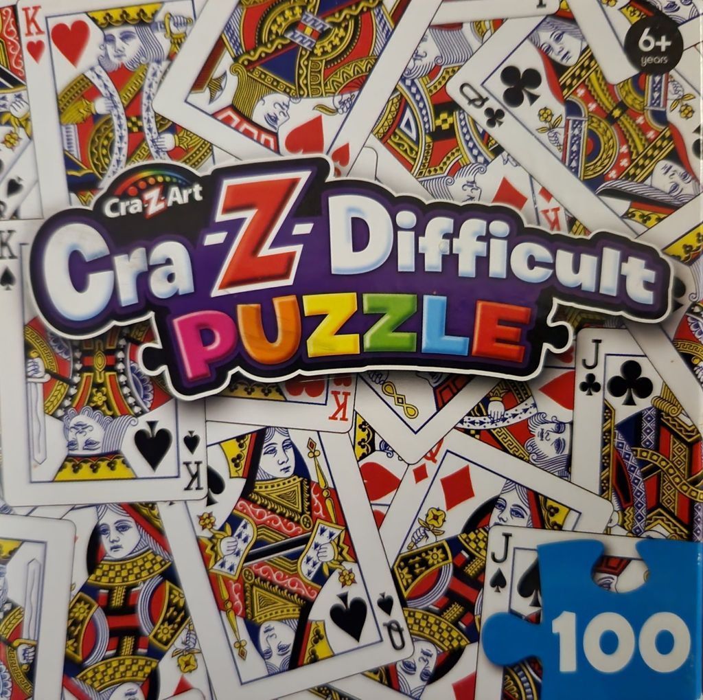 A chaotic, overlapping pattern of various playing cards featuring kings, queens, and jacks.