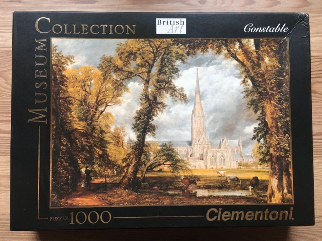 Painting of Salisbury Cathedral by John Constable framed by large autumn trees with cattle in the foreground.