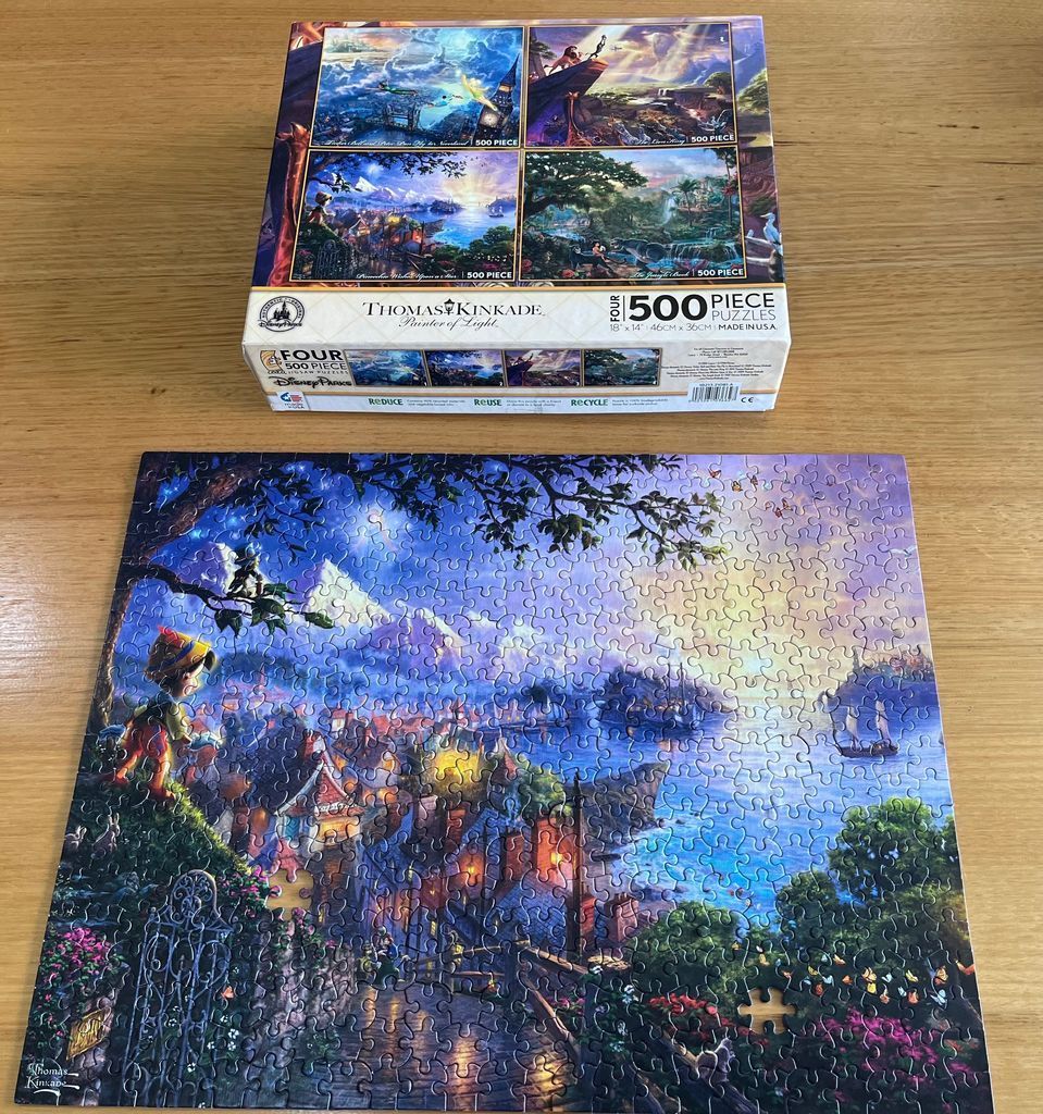 An illustrated depiction of Pinocchio looking over a magical seaside village at sunset.