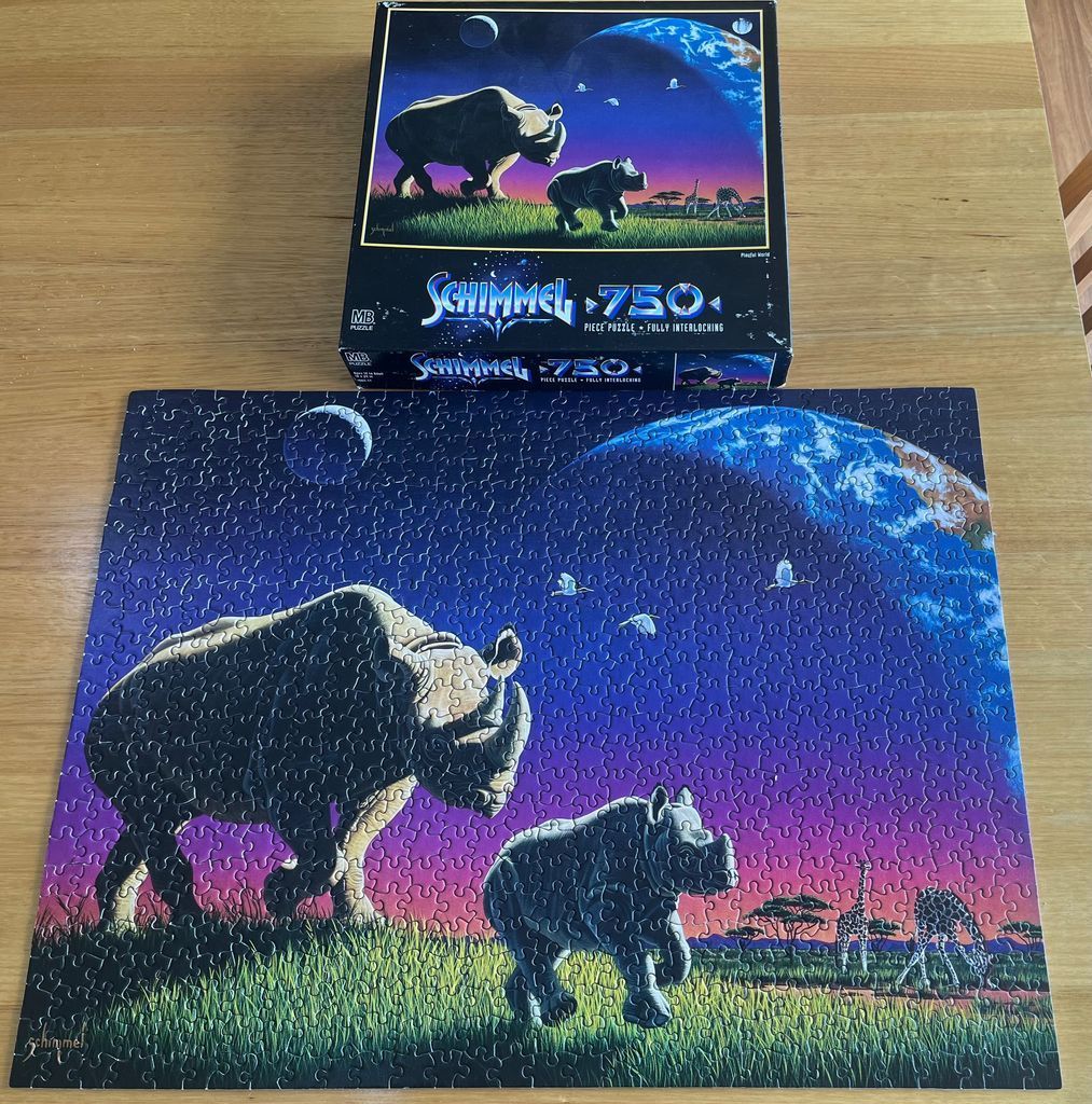 A surreal illustration of a rhinoceros and calf walking on a grassy plain under a large planet and starry night sky.