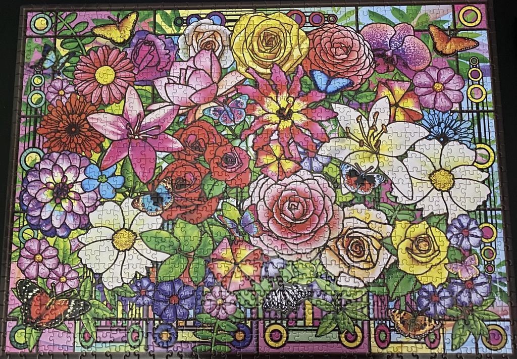 A vibrant illustration of a dense garden of various colorful flowers and butterflies in a stained glass style.