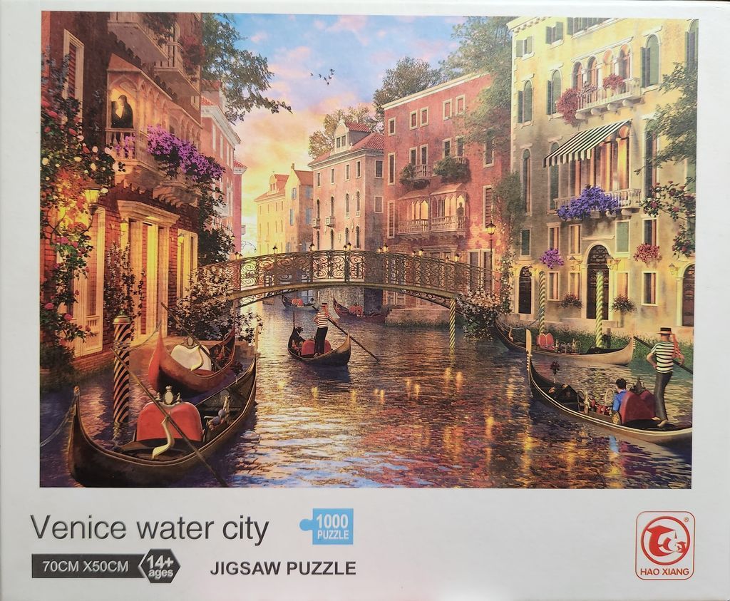 A romantic sunset scene of a Venetian canal with gondolas and traditional buildings.