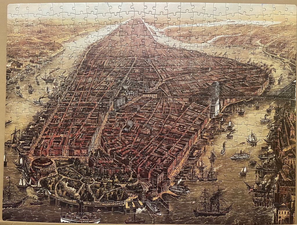 An aerial 19th-century map illustration of Manhattan, featuring the harbor, busy waterways, and a large suspension bridge.