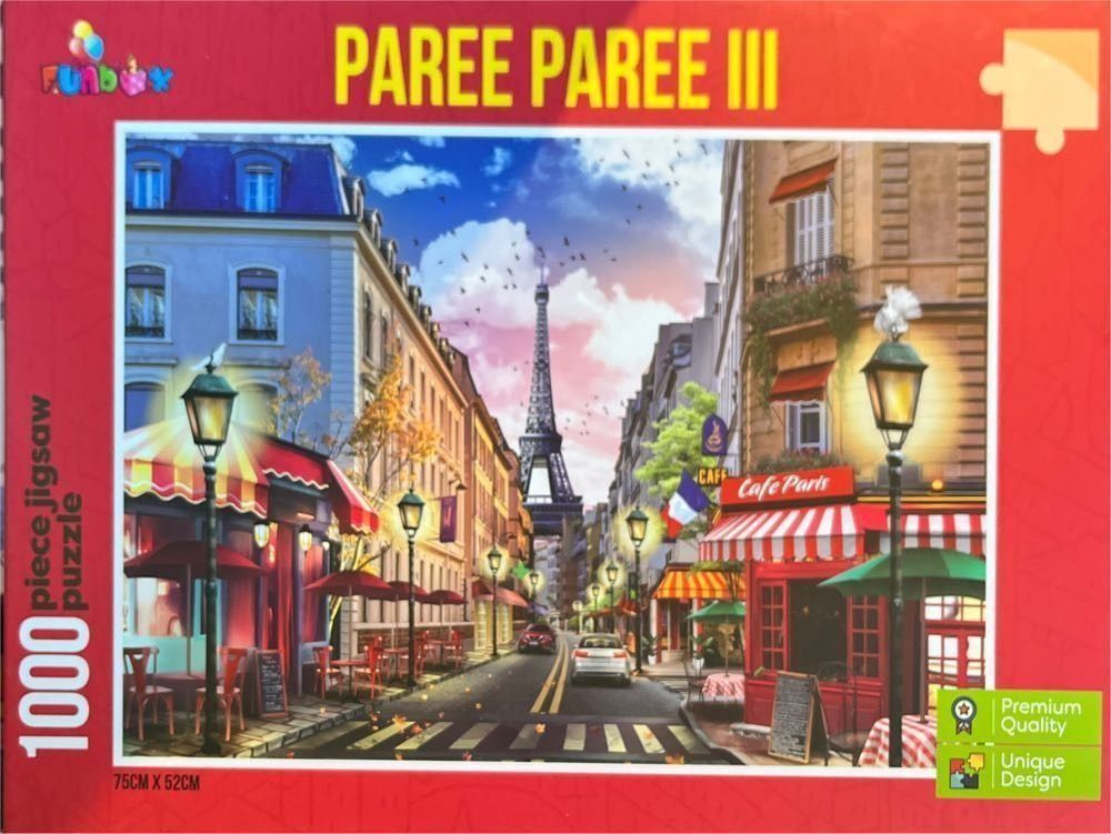 A Parisian street scene featuring the Eiffel Tower in the distance between traditional buildings and outdoor cafes.