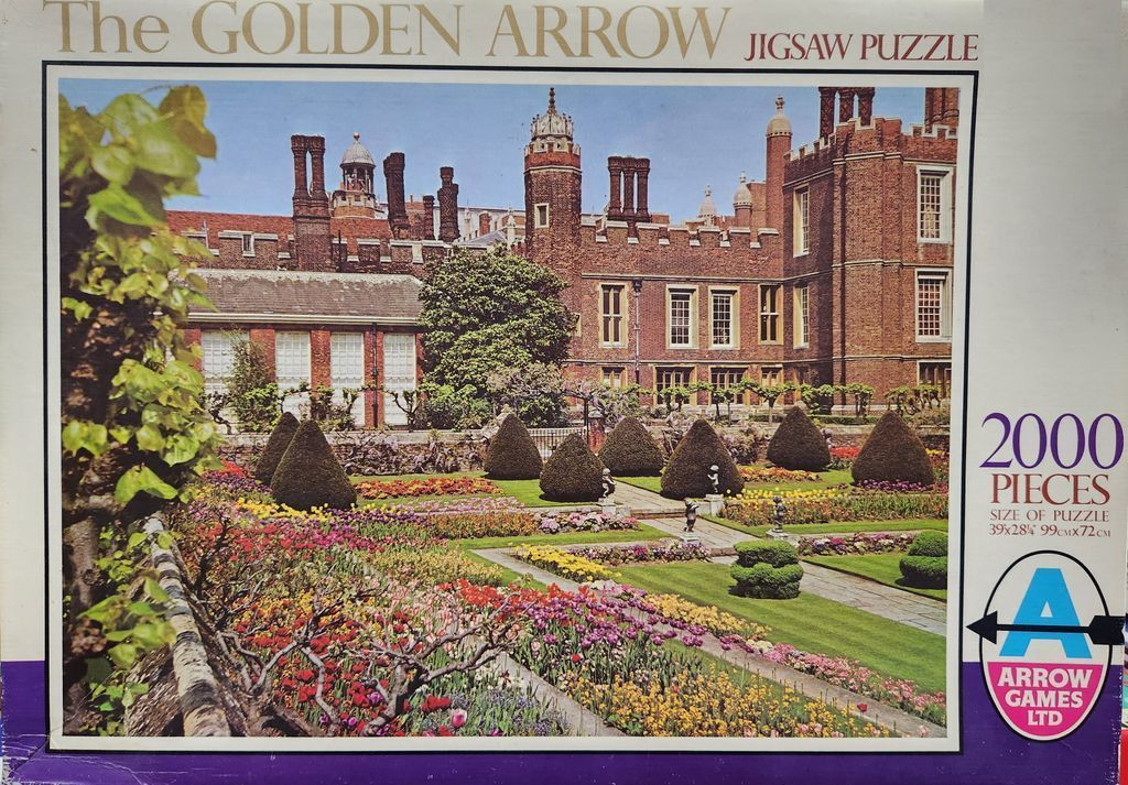 A view of the Tudor-style Hampton Court Palace and its formal sunken gardens.