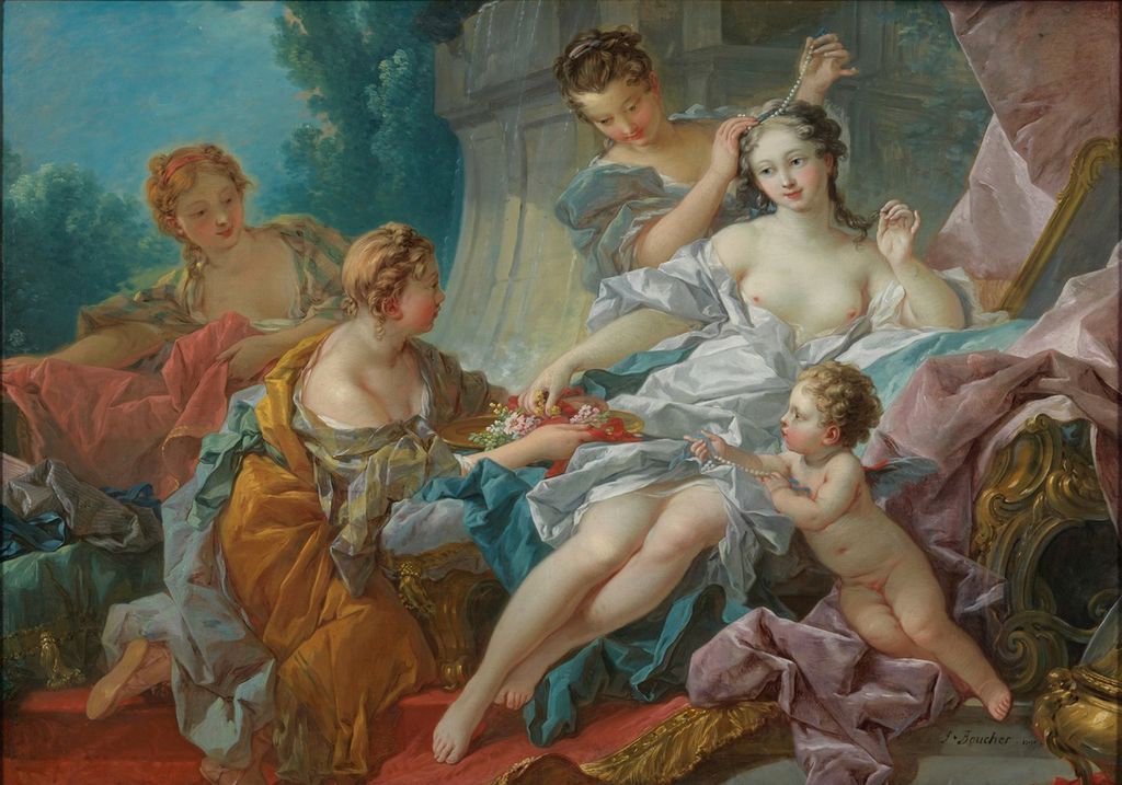 A group of women and a cherub gathered around a reclining figure who is decorating her hair with pearls.