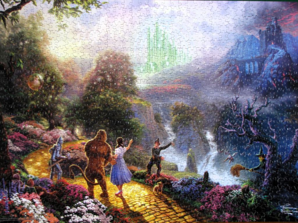 Dorothy and friends walking along the yellow brick road toward the Emerald City.