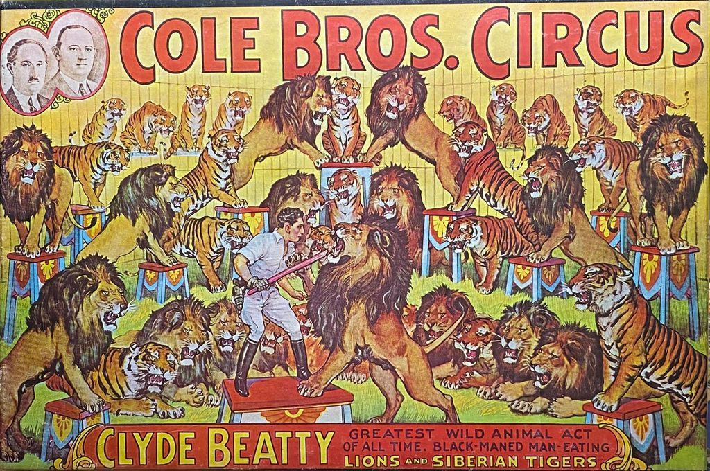 Vintage circus poster art featuring Clyde Beatty standing in a ring surrounded by numerous lions and tigers on pedestals.