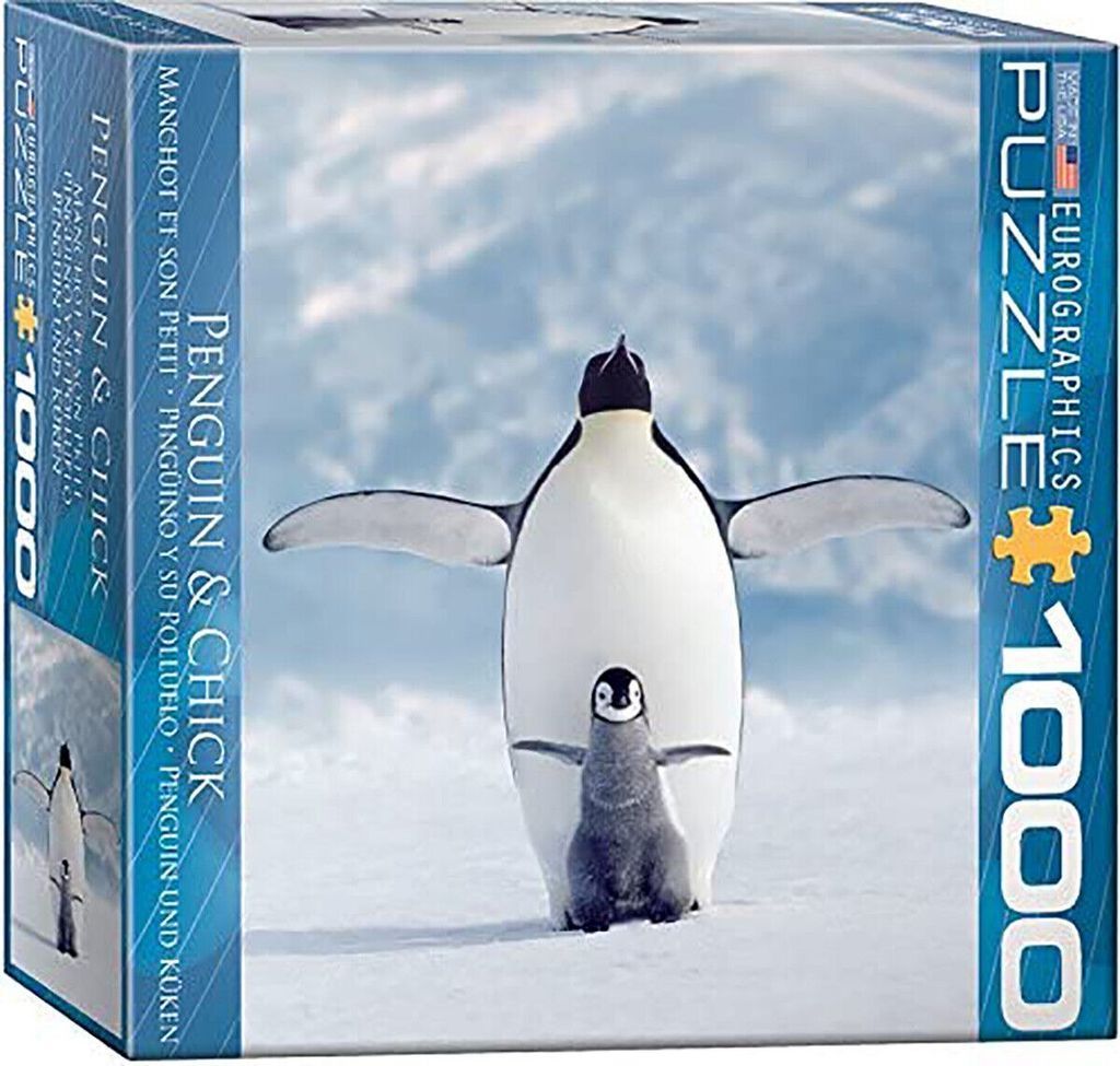 An adult Emperor penguin standing over its small grey chick against a snowy Antarctic landscape.