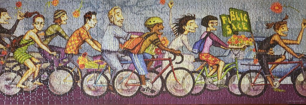 An illustration of a diverse group of people riding bicycles in a procession across the frame.