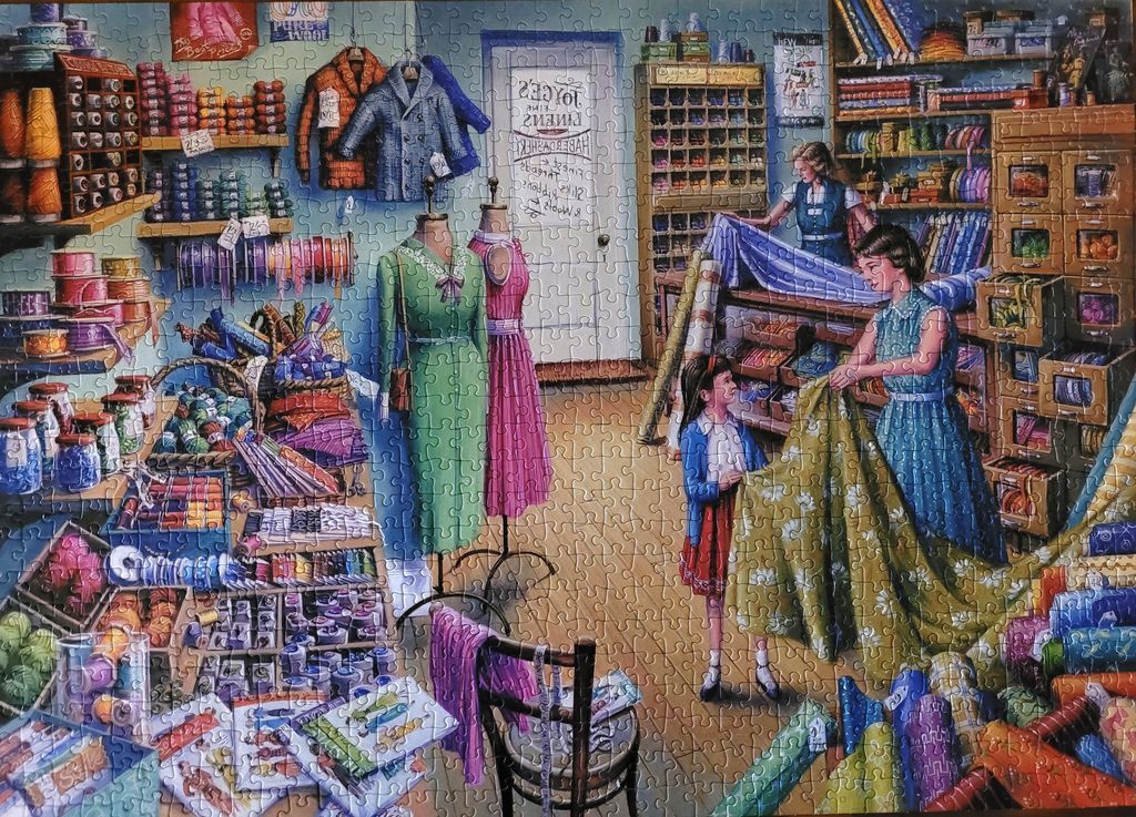 A nostalgic illustration of a busy, colourful 1950s haberdashery store with mannequins, fabric rolls, and sewing supplies.
