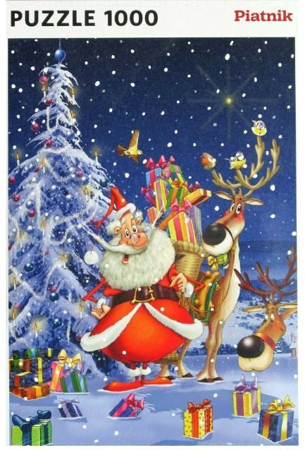 Santa Claus standing next to two reindeer and a snowy Christmas tree at night.