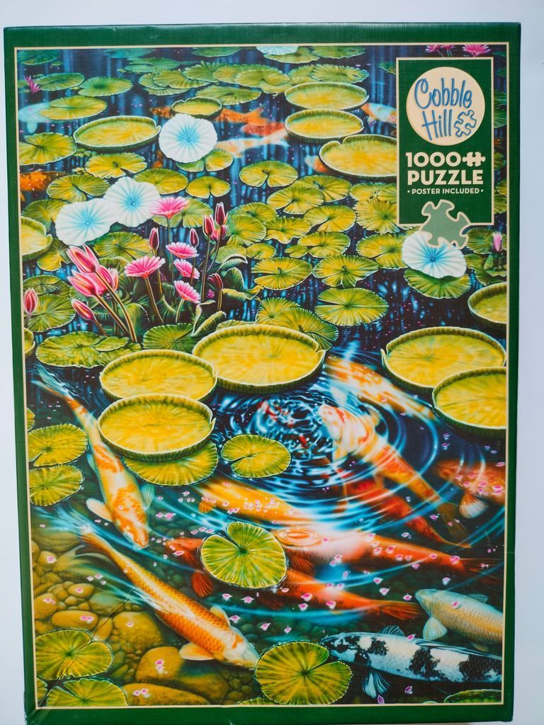 Vibrant pond scene with koi fish swimming among numerous floating lily pads and pink lotus flowers.