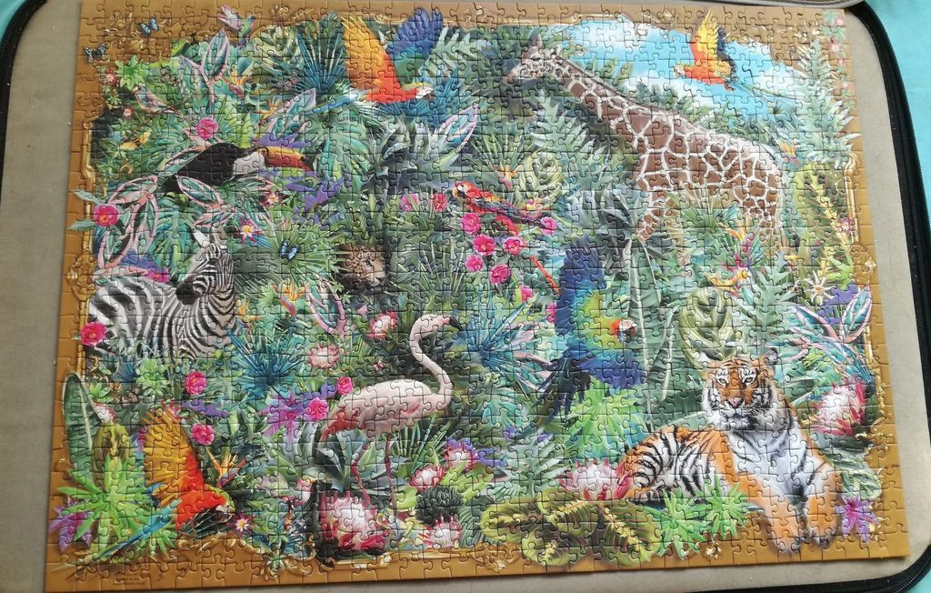 A lush jungle scene filled with diverse animals including a giraffe, tiger, zebra, flamingo, and colorful parrots.