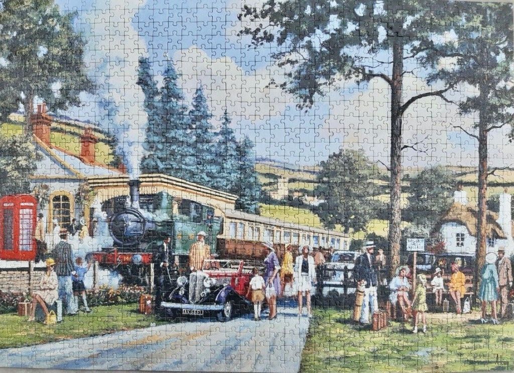 A vintage steam train at a countryside station with passengers and a classic car in the foreground.