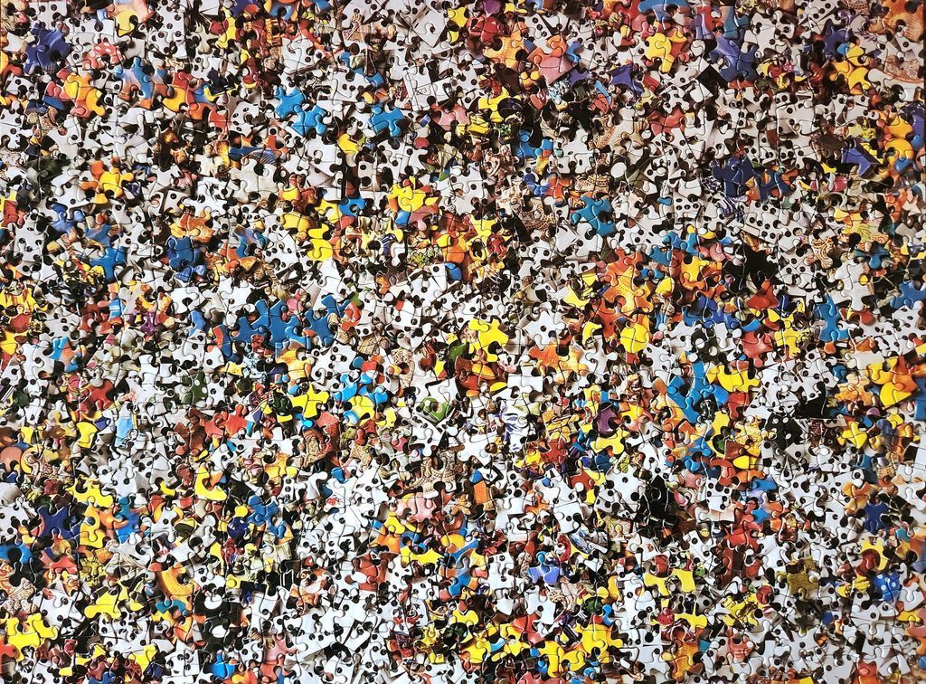 An abstract collage of varied cartoon figures, patterns, and vibrant shapes.