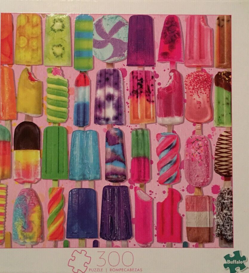 A grid of colorful, assorted popsicles on a pink, paint-splattered background.