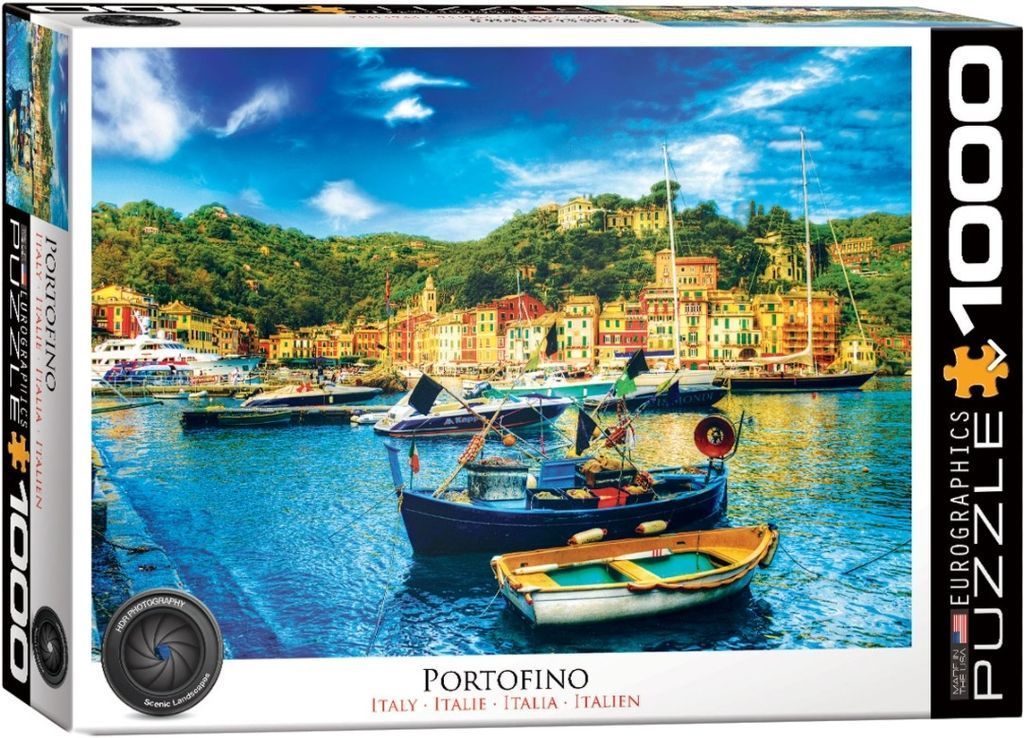 A vibrant photograph of the colorful seaside village of Portofino, Italy, with boats in the harbor.
