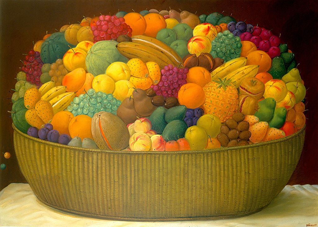 A massive, overflowing woven basket filled with an abundant variety of colorful fresh fruits.