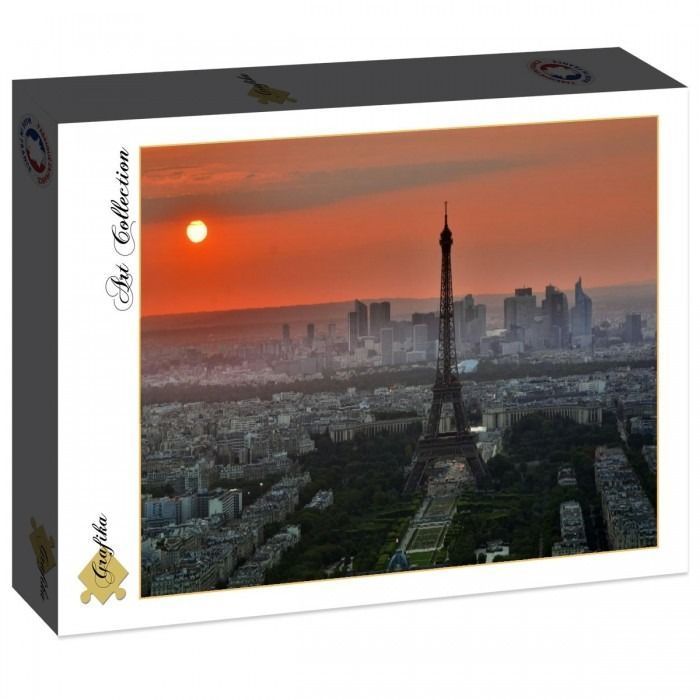 Aerial view of the Eiffel Tower at sunset, overlooking the Paris skyline.