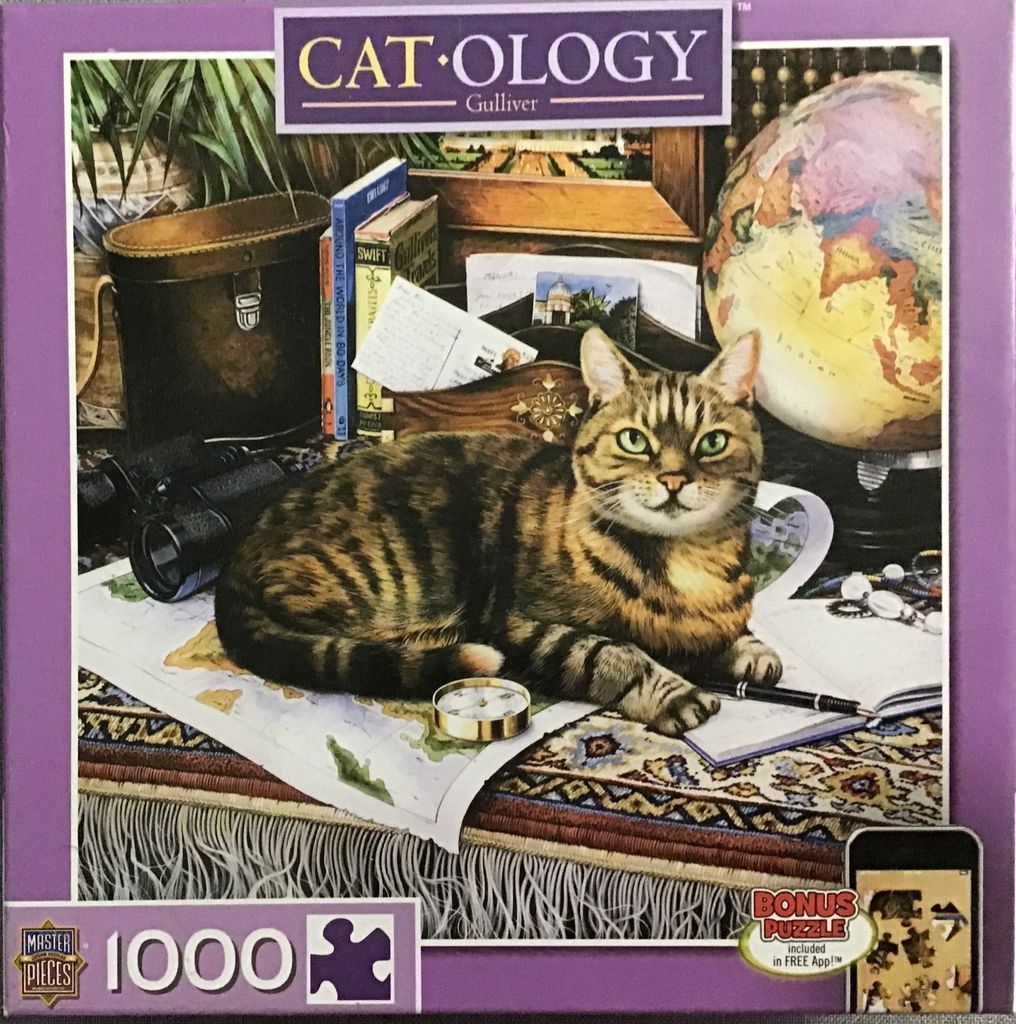 A tabby cat resting on a world map surrounded by a globe, books, and vintage travel gear.