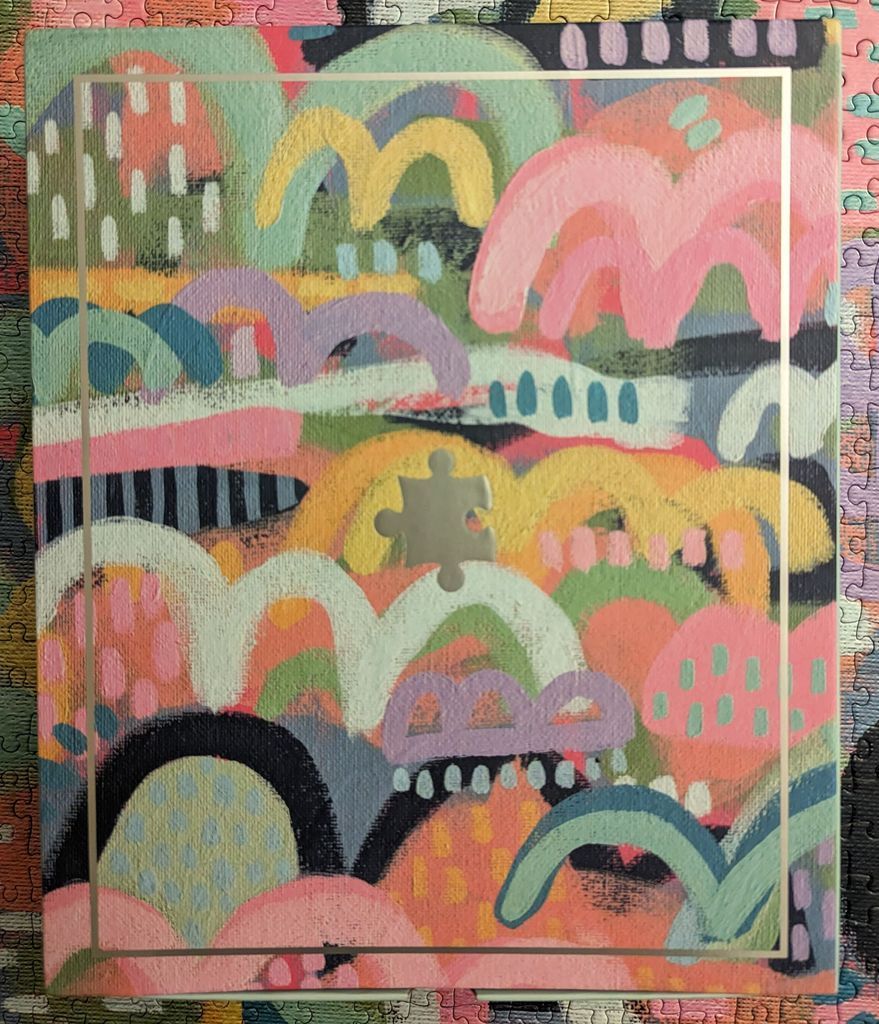 Abstract painting with overlapping arches and dots in pastel and bright colors, centered by a gold puzzle piece icon.