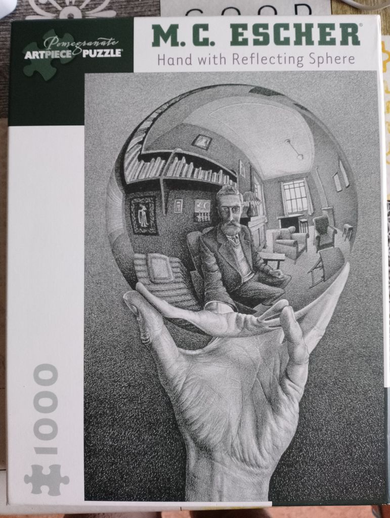 Black and white lithograph of a hand holding a reflective sphere containing a self-portrait in a room.