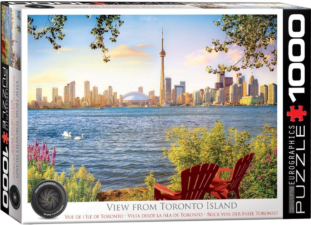 A scenic photograph of the Toronto skyline across the water as viewed from a park with red chairs and swans.
