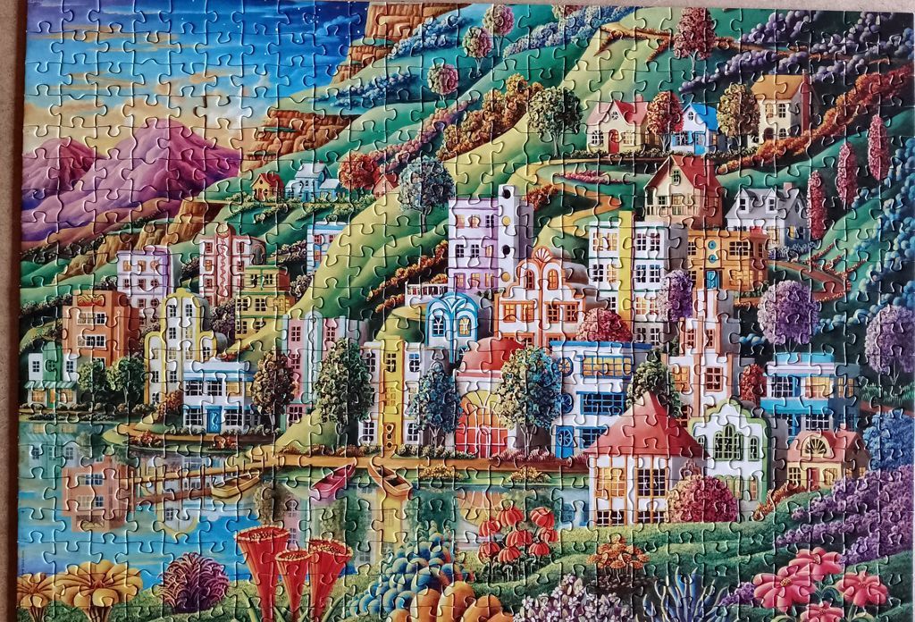 A whimsical illustration of a colorful hillside town overlooking a tranquil lake with vibrant flora.