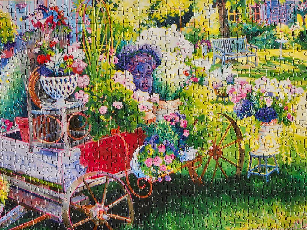 A lush, colorful garden scene with a decorative red wagon filled with flowers, painted in an impressionistic style.