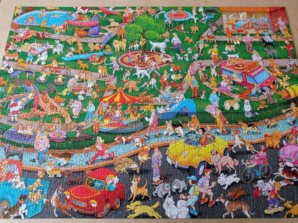 Busy cartoon illustration of a dog park filled with many different dog breeds and human owners.