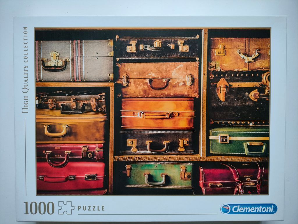 A collection of vintage suitcases stacked neatly on wooden shelves.