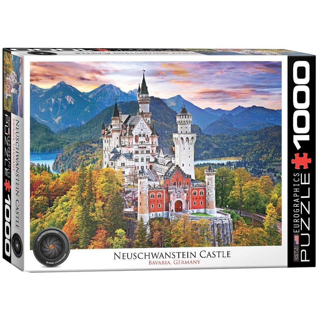 Neuschwanstein Castle in Bavaria, Germany, during autumn at sunset with mountains in the background.