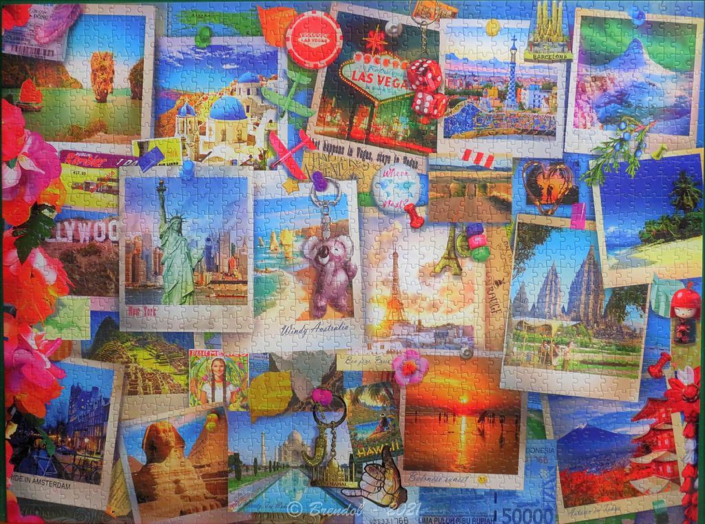 A collage of travel photographs, souvenirs, and mementos depicting famous landmarks around the world.