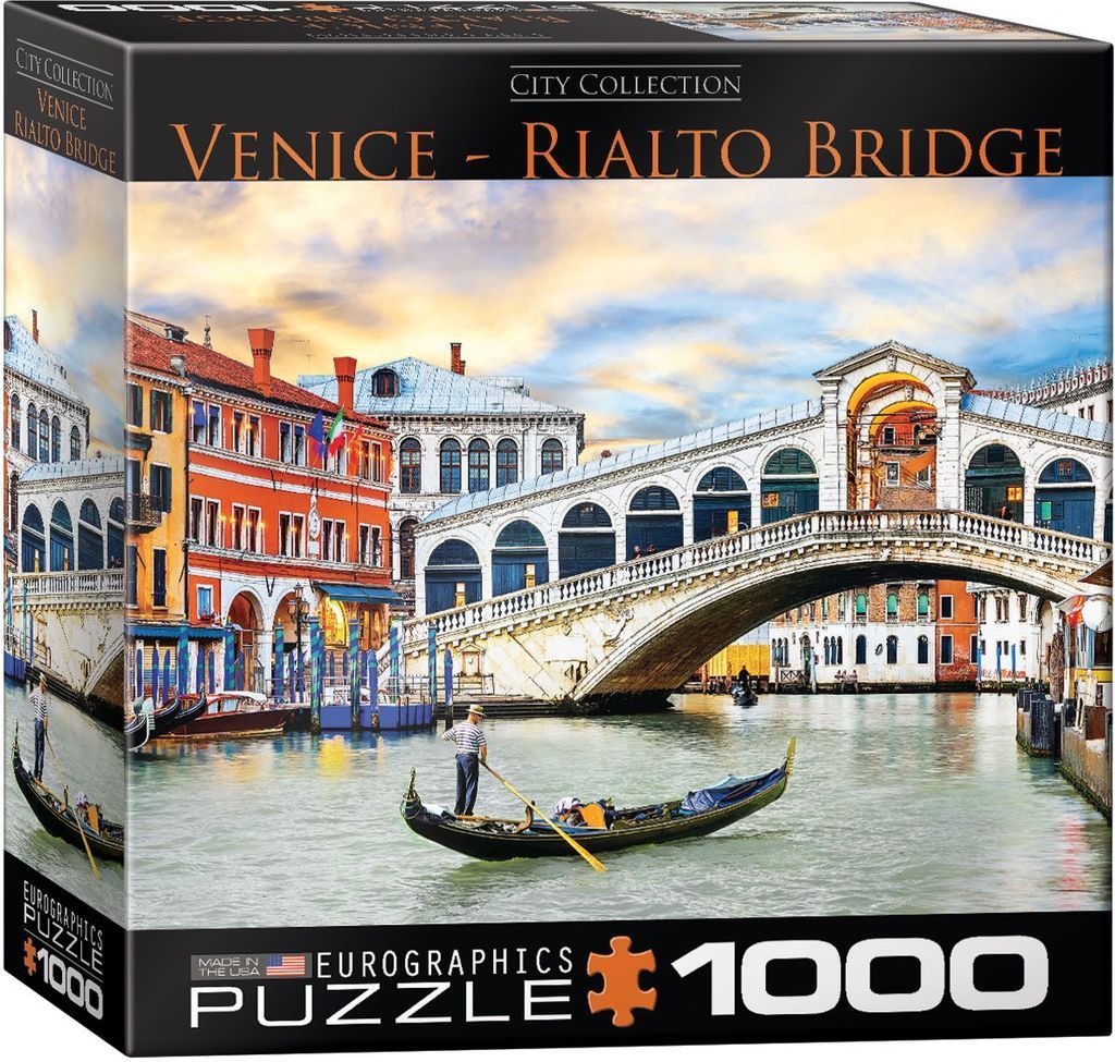 A gondolier navigates the Grand Canal beneath the Rialto Bridge in Venice at sunset.