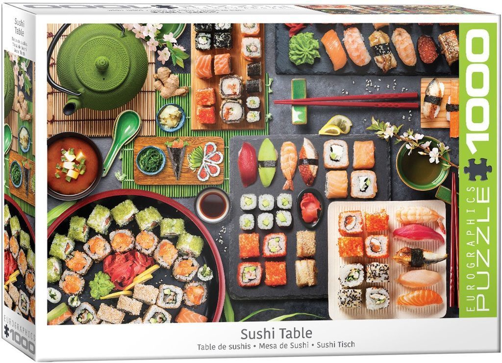 Top-down photographic view of a Japanese sushi feast spread across a dark textured table.