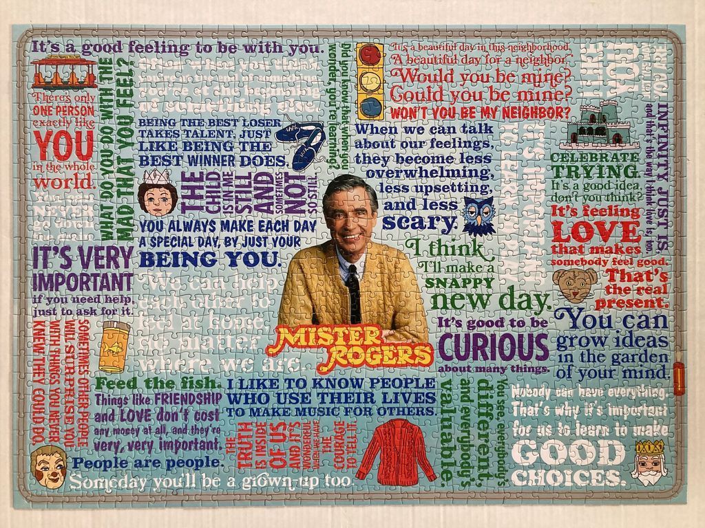 A collage featuring Fred Rogers, his iconic red cardigan, and many inspirational quotes from his television program.