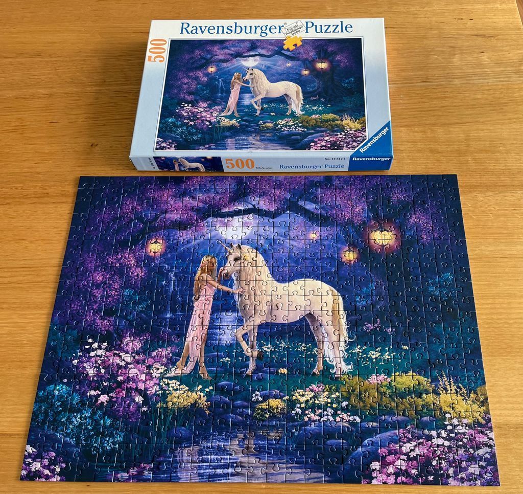 Fantasy illustration of a girl touching a white unicorn in a moonlit, purple garden.