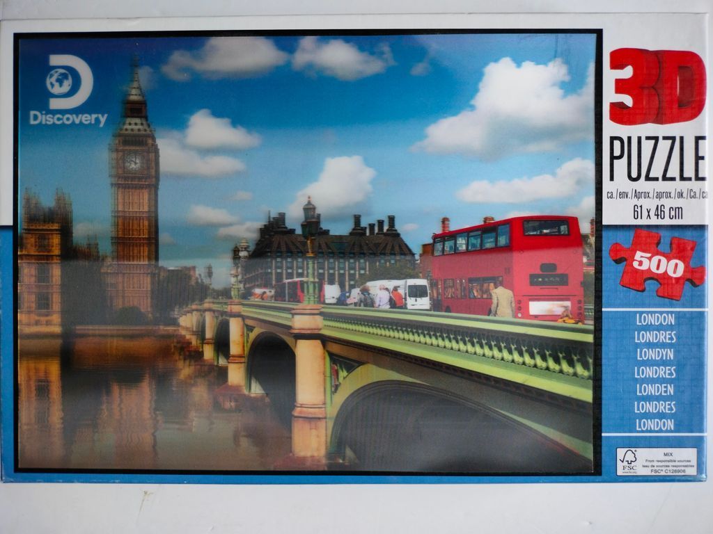 A photograph of Westminster Bridge and Big Ben in London, with a bright red double-decker bus on the road.