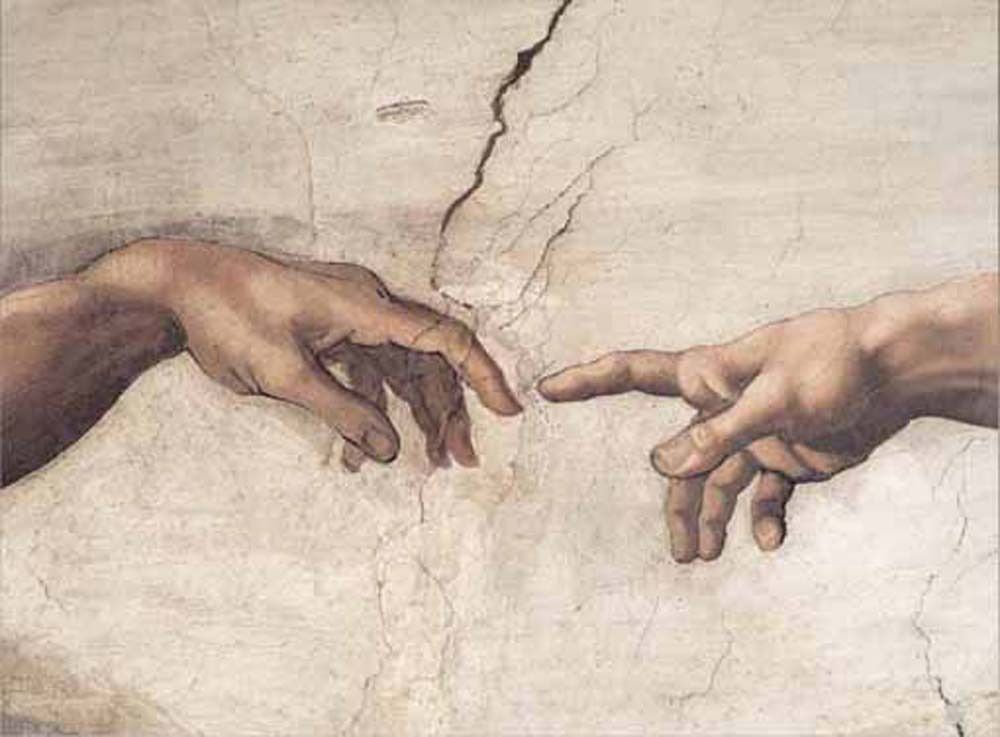 Close-up of two hands reaching toward each other, painted on a textured, cracked plaster surface.