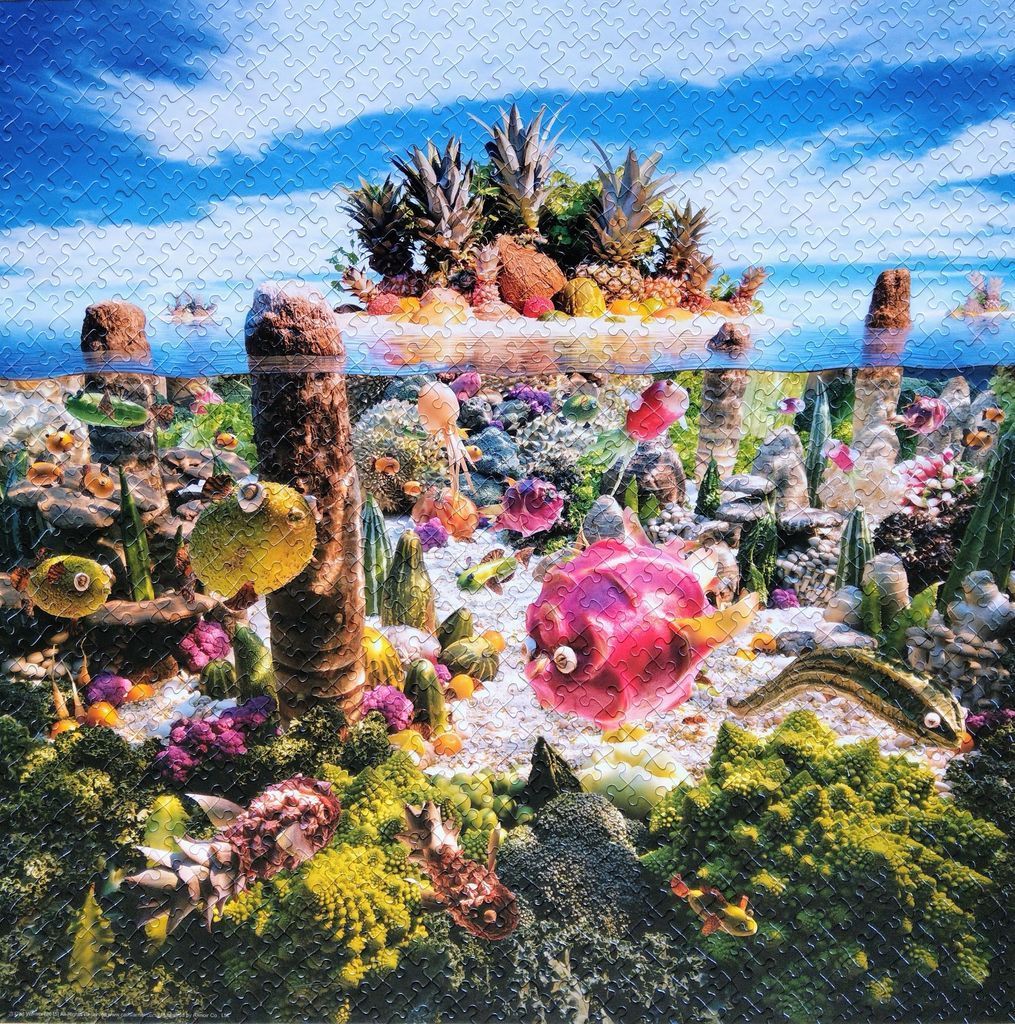 Surreal underwater scene featuring fish made of fruit and vegetables in a garden-like reef.