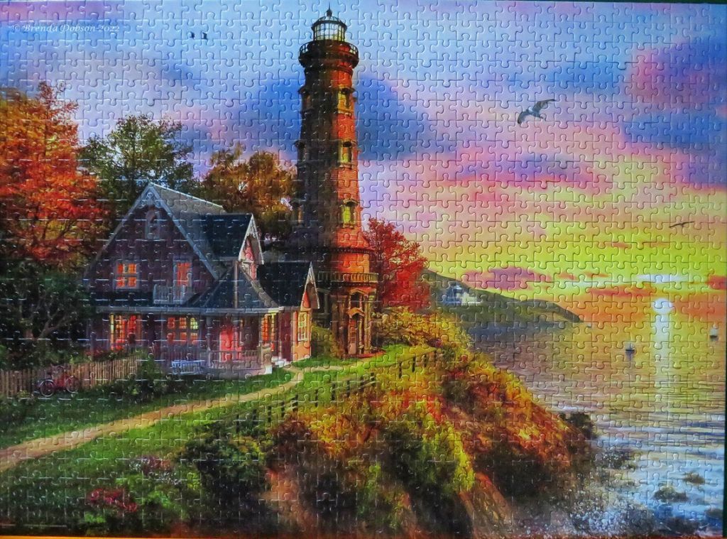 A lighthouse and keeper
